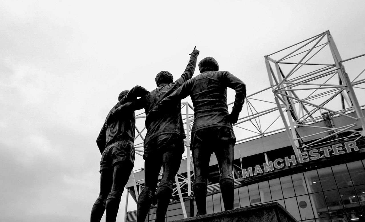 Old Trafford and the United Trinity statue, shown on the official Manchester marketingSHOWCASE page.